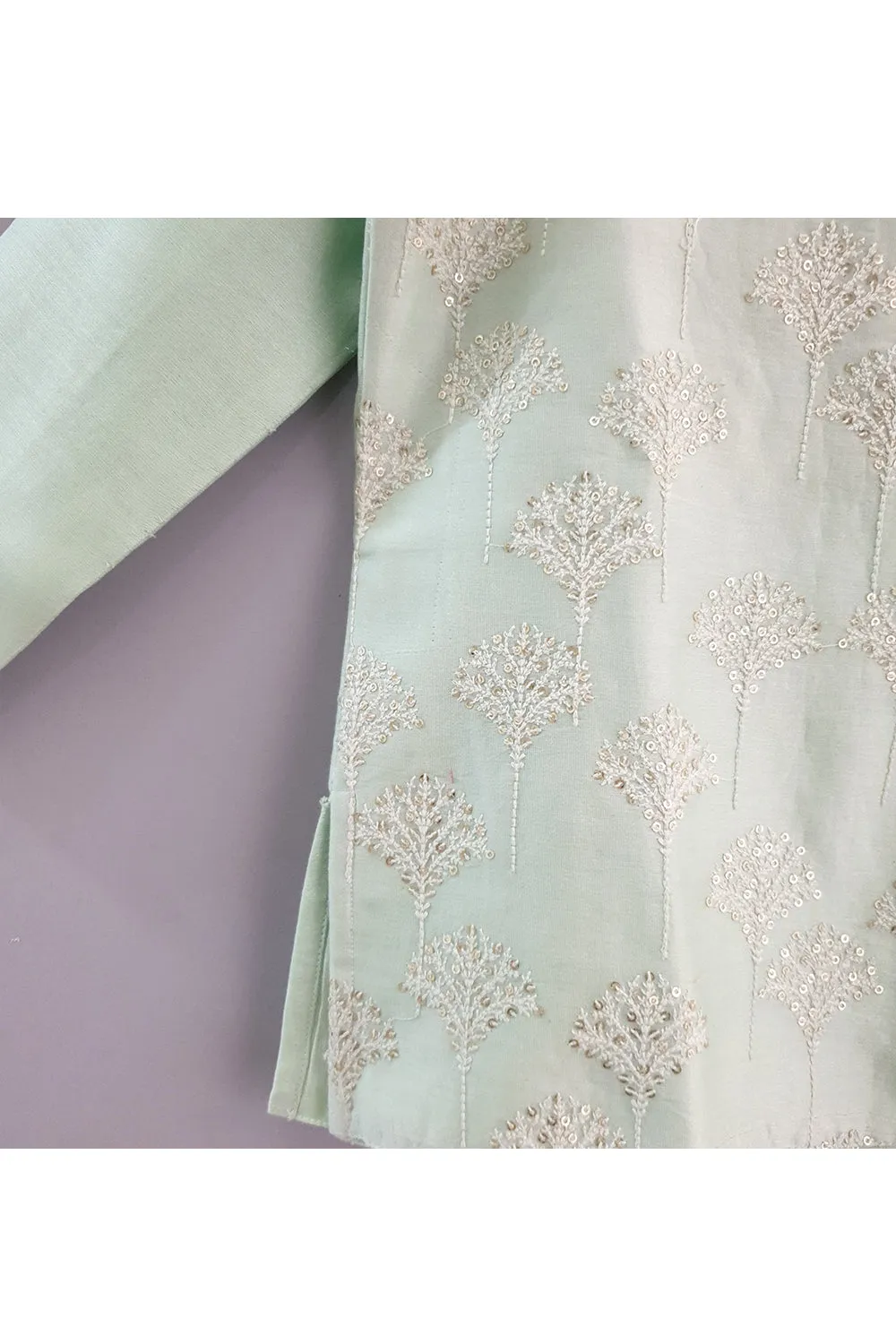 Light green kurta and pyjama with embroidered jacket