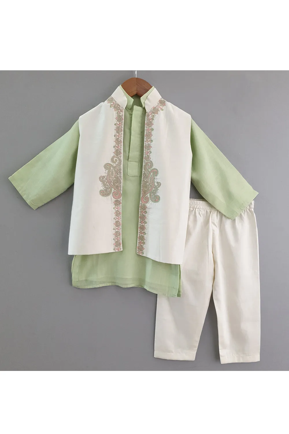 Light green kurta and pyjama with embroidered jacket